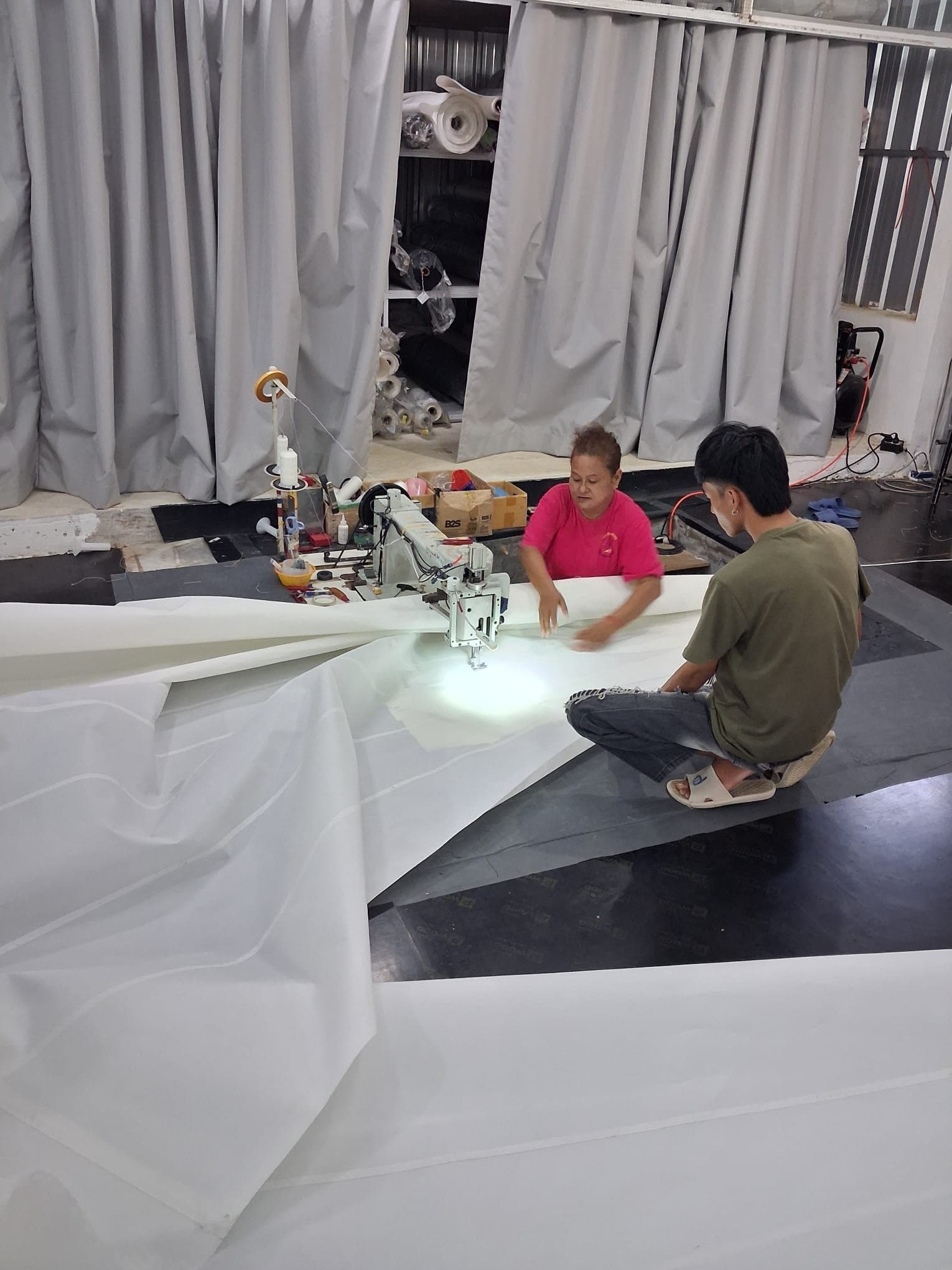 Hunter 25 sail being sewn on the loft floor