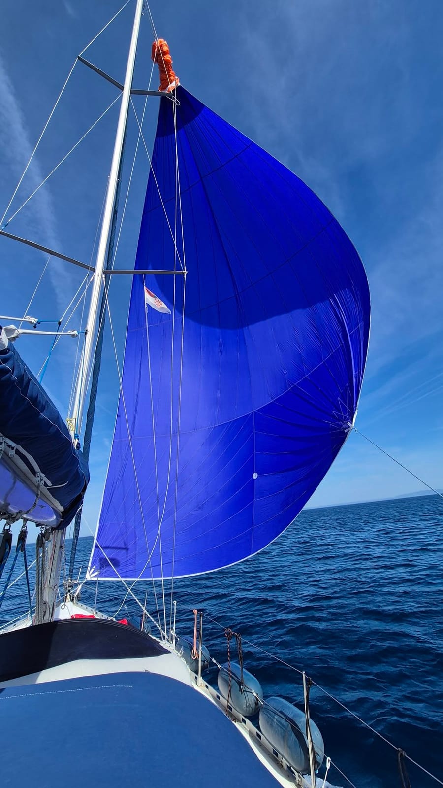 Large light-air sail drawing on a catamaran